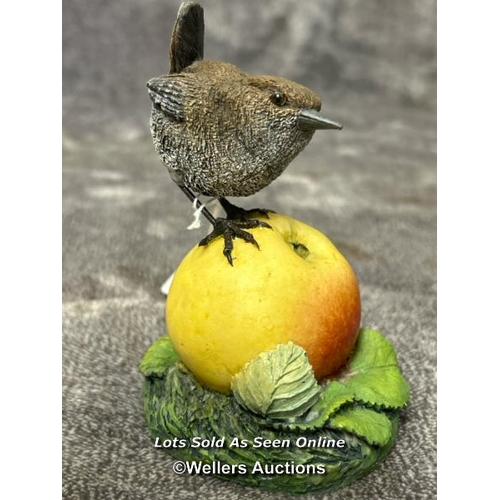 97 - A collection of four Arden Sculptures by Christopher Holt, including Wren on Apple, Wren, Bluetit an... 