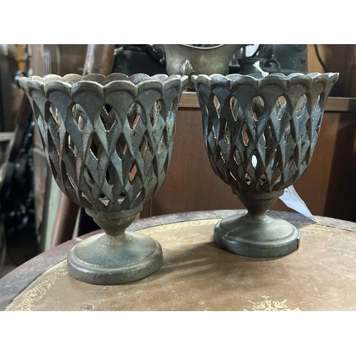 13 - A rare pair of matching hatched Ralph Lauren cast iron urns, each 16cm high, with 'RL' plaque to bas... 