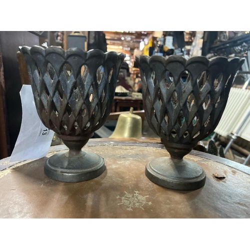 13 - A rare pair of matching hatched Ralph Lauren cast iron urns, each 16cm high, with 'RL' plaque to bas... 