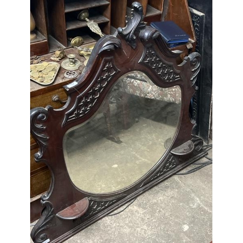 17 - A carved oak wall mirror, 100cm high x 120cm wide