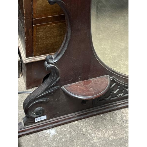 17 - A carved oak wall mirror, 100cm high x 120cm wide