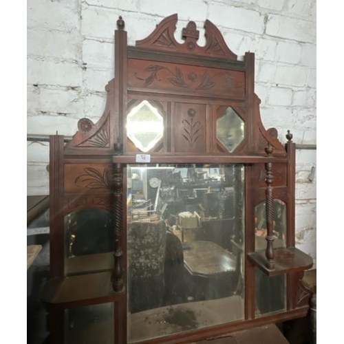 18 - A carved Victorian wall mirror, flanked by two shelves and one above, 108cm high x 87cm wide