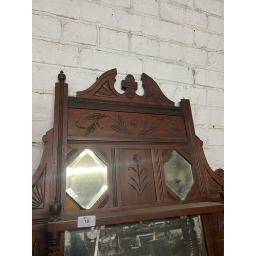 18 - A carved Victorian wall mirror, flanked by two shelves and one above, 108cm high x 87cm wide