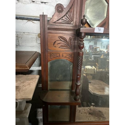 18 - A carved Victorian wall mirror, flanked by two shelves and one above, 108cm high x 87cm wide