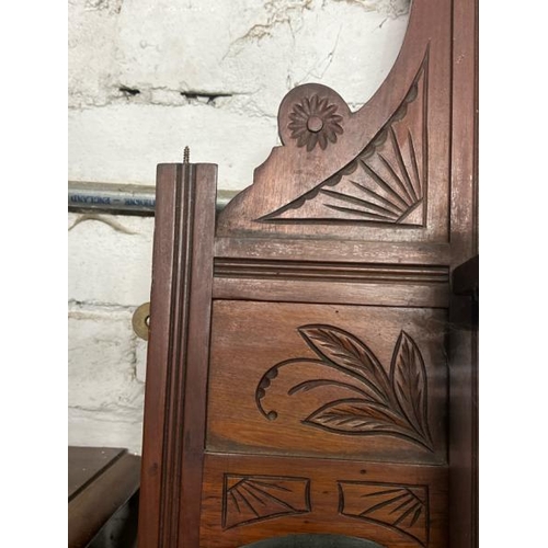 18 - A carved Victorian wall mirror, flanked by two shelves and one above, 108cm high x 87cm wide