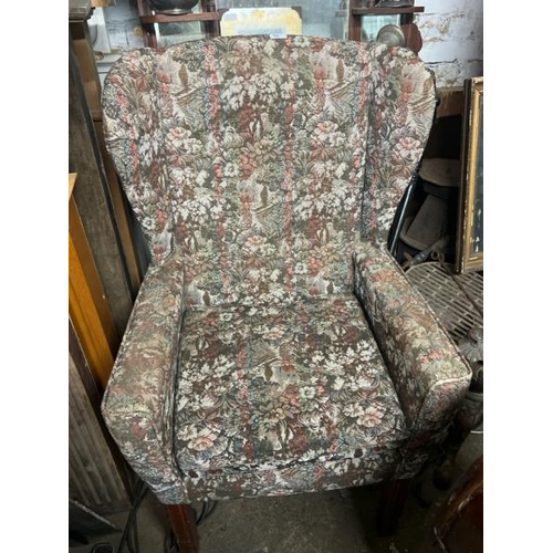 20 - A reproduction upholstered armchair, 110cm high x 70cm wide x 70cm deep