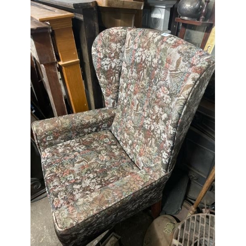 20 - A reproduction upholstered armchair, 110cm high x 70cm wide x 70cm deep