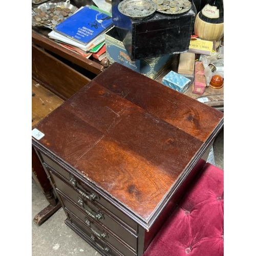 26 - A reproduction chest of six drawers with upholstered seat, 70cm high x 93cm wide x 39cm deep