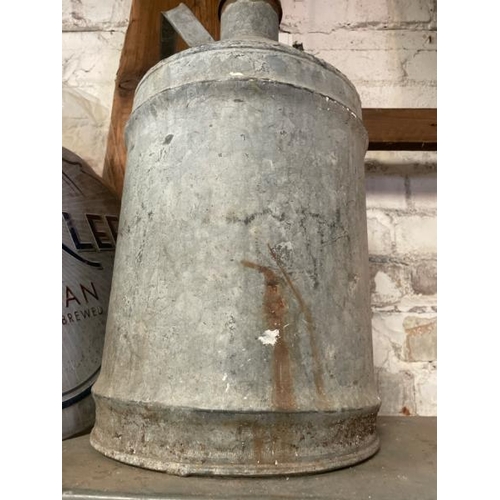 38 - A galvanised milk jug, 56cm high