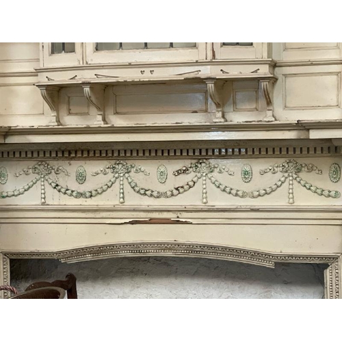 47 - A large and ornately carved wooden fire surround, in the style of Robert Adams, with drapery feature... 