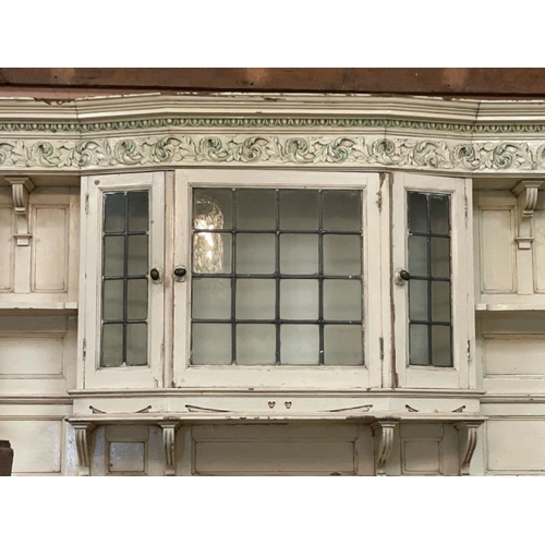 47 - A large and ornately carved wooden fire surround, in the style of Robert Adams, with drapery feature... 