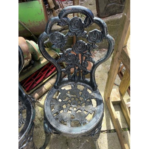 53 - A pair of cast iron garden chairs, 82cm high