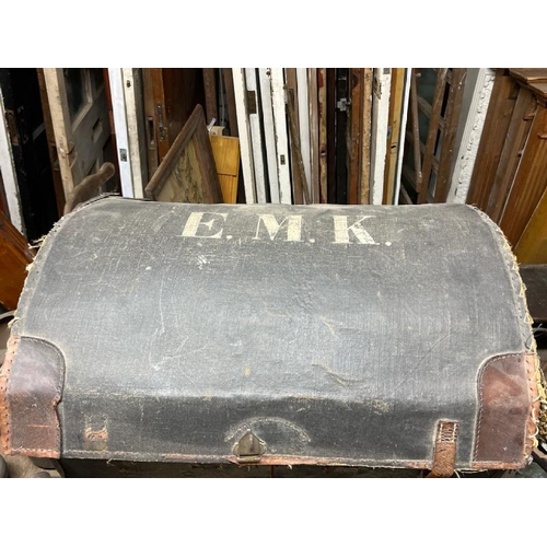 7 - A canvas bound steamer chest, with letters E.M.K to the top, requires some repairs, 60cm high x 77cm... 