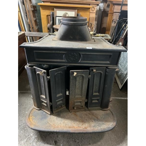 8 - A large victorian cast iron fire stove, 95cm high x 74cm wide x 54cm deep