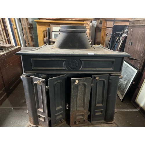 8 - A large victorian cast iron fire stove, 95cm high x 74cm wide x 54cm deep