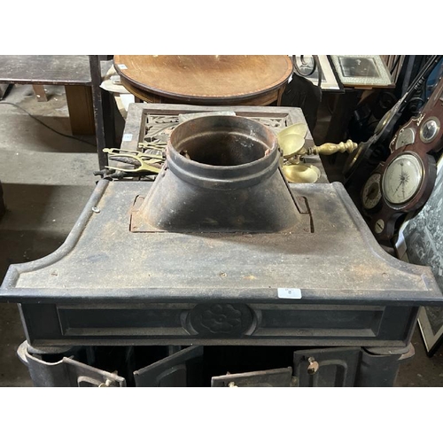 8 - A large victorian cast iron fire stove, 95cm high x 74cm wide x 54cm deep