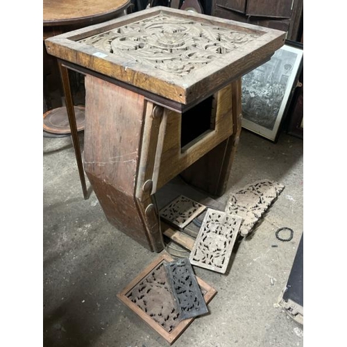 9 - A decorative wooden table with carved centrepiece, converted to electric, with associated panelling,... 