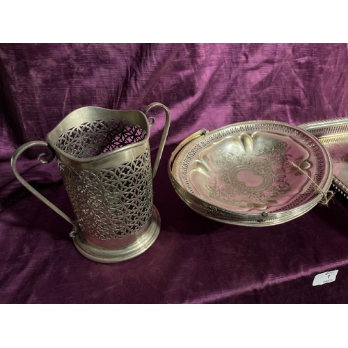 1 - Assorted silver plate including a toast rack, bottle holder, tray etc  / All lots are located at The... 