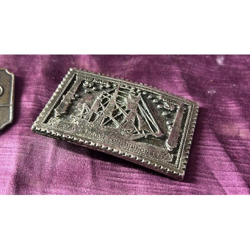 104 - Two belt buckles, Marlboro and U.S Frigate  / All lots are located at The Barn, Hampstead Farm, Nr H... 