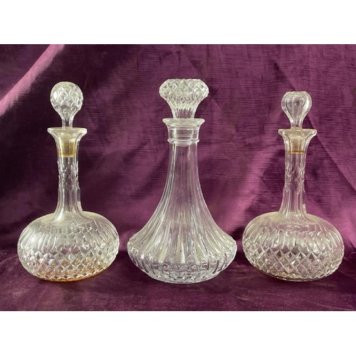 18 - Three cut glass shops decanters, tallest 26cm (h)  / All lots are located at The Barn, Hampstead Far... 