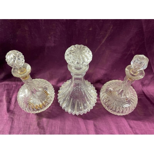 18 - Three cut glass shops decanters, tallest 26cm (h)  / All lots are located at The Barn, Hampstead Far... 