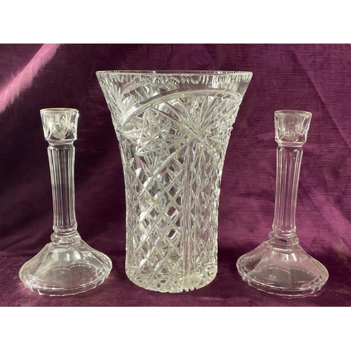 23 - Cut glass vase, 26cm (h) and a pair of glass candle sticks, 22.5cm (h)  / All lots are located at Th... 