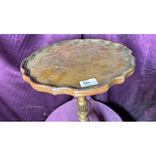 390 - A small occasional table with walnut pie crusted top and mahogany triform base, 50cm (h) x 35cm (dia... 