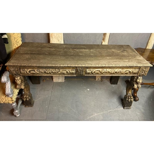 394 - A gothic revival/jacobean style profusely carved oak hallway/console table on lion legs, 75cm (h) x ... 