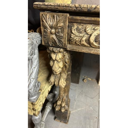 394 - A gothic revival/jacobean style profusely carved oak hallway/console table on lion legs, 75cm (h) x ... 