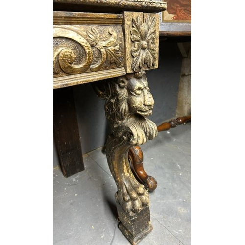 394 - A gothic revival/jacobean style profusely carved oak hallway/console table on lion legs, 75cm (h) x ... 