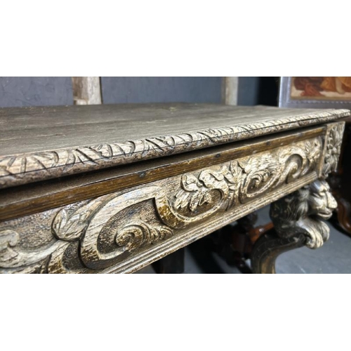 394 - A gothic revival/jacobean style profusely carved oak hallway/console table on lion legs, 75cm (h) x ... 