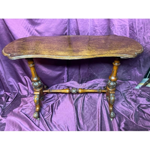 395 - 19th century walnut coffee table with profusely carved legs on original casters, 71cm (h) x 104cm (w... 