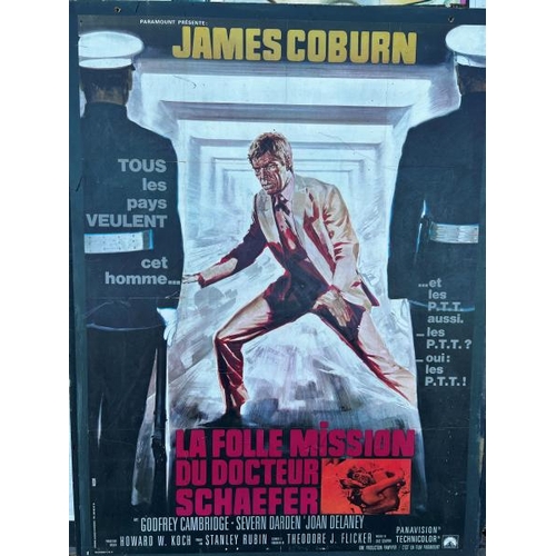 419 - An original 'La Folle Mission Du Docteur Schaefer' film poster on board, featuring James Coburn  / A... 