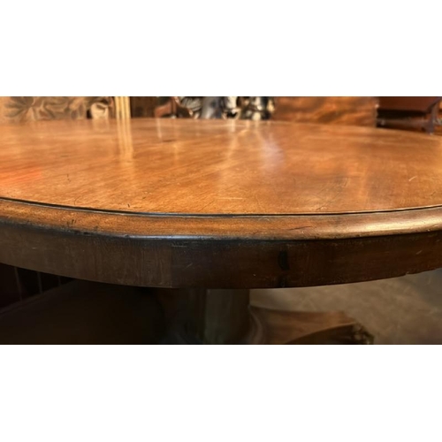 468 - A 19th century mahogany circular dining table on triform base with finely carved claw feet and origi... 