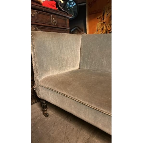 469 - Early 20th century upholstered sofa on fluted mahogany legs with original casters, 75cm (h) x 145cm ... 