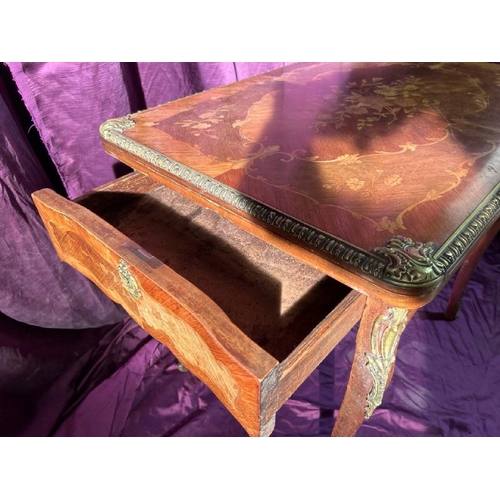 475 - A 20th century Louis XV style metamorphic games table with profuse floral inlay using exotic timbers... 