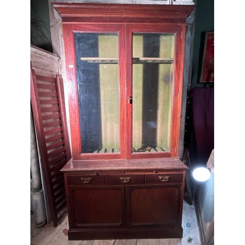 482 - An early 20th century mahogany gunsmith's cabinet with glazed upper and sectional green bazed gunrac... 