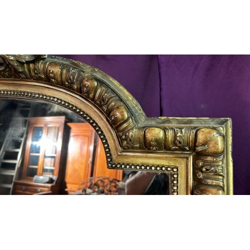 488 - A large 19th century wall mirror with gilt frame and ormolu style centrepiece, requires some restora... 