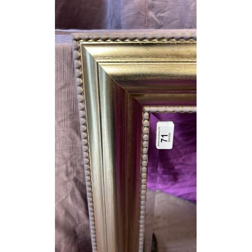 490 - A large bevelled edge mirror with beaded frame, 118cm (w) x 92.5cm (h)  / All lots are located at Th... 