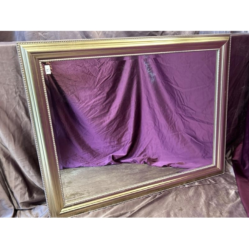 490 - A large bevelled edge mirror with beaded frame, 118cm (w) x 92.5cm (h)  / All lots are located at Th... 