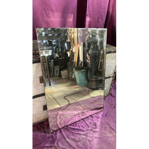 492 - A 20th century beviled wall mirror, without frame, 75cm (h) x 54cm (w)  / All lots are located at Th... 