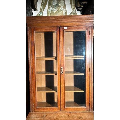 499 - A 19th century oak display cabinet with glazed upper, four internal shelves over single drawer and c... 