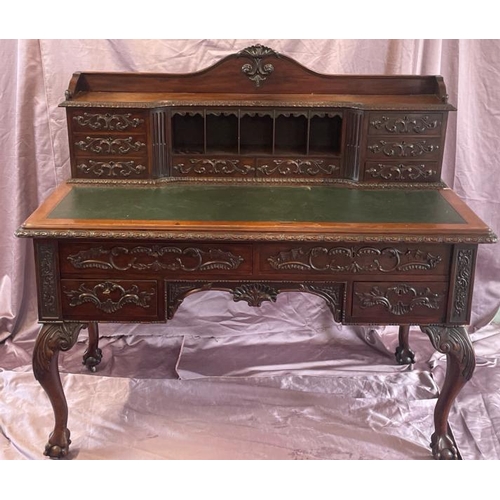 501 - A circa 1900, Georgian style highly decorative and carved mahogany lined writing desk with leather i... 