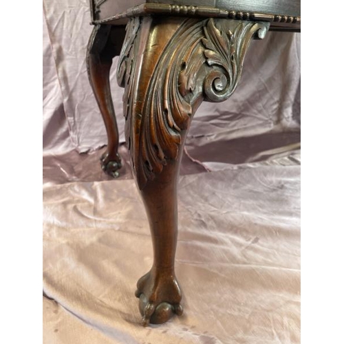 501 - A circa 1900, Georgian style highly decorative and carved mahogany lined writing desk with leather i... 