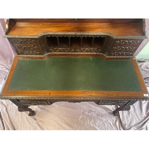 501 - A circa 1900, Georgian style highly decorative and carved mahogany lined writing desk with leather i... 