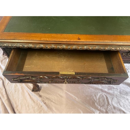 501 - A circa 1900, Georgian style highly decorative and carved mahogany lined writing desk with leather i... 