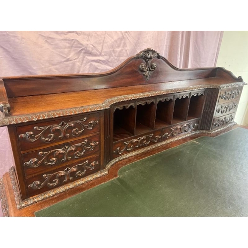 501 - A circa 1900, Georgian style highly decorative and carved mahogany lined writing desk with leather i... 