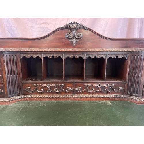 501 - A circa 1900, Georgian style highly decorative and carved mahogany lined writing desk with leather i... 