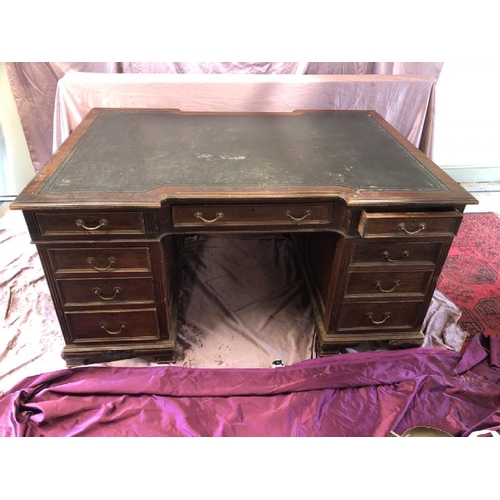 502 - A large Edwardian mahogany partners desk with leather inlaid, complete with nine drawers to one side... 