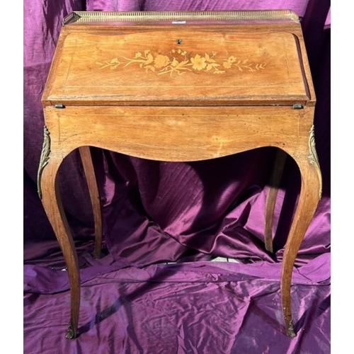 503 - A 19th century Louis XV style bureau with leather inlay, upper gilt surround and floral detailing to... 